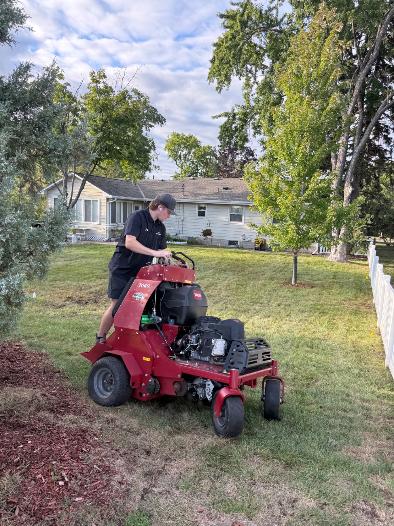 Freshly mowed residential lawn with crisp edges and healthy turf